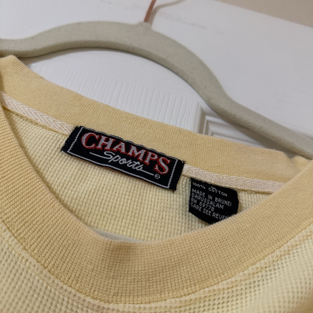 Yellow Champs Sports tee size L